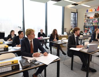 Pupils studying in a classroom