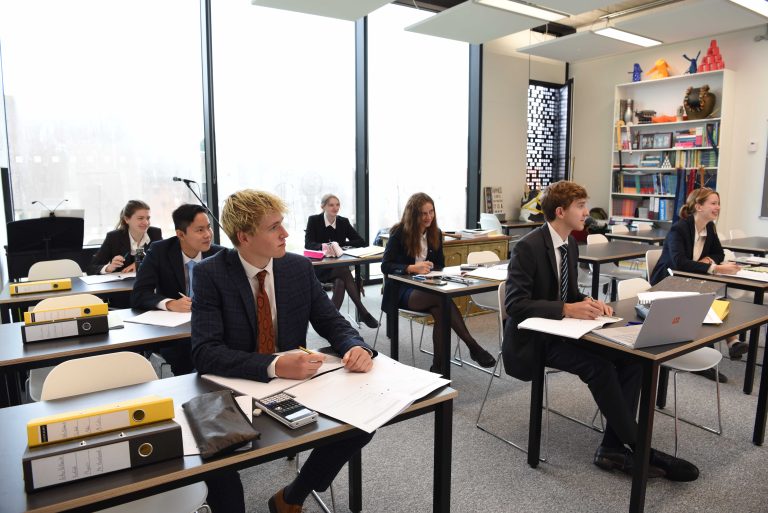 Pupils studying in a classroom